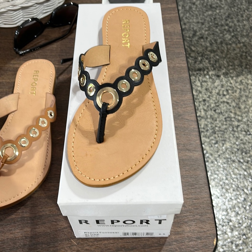 Report brand purchase from Macys. Never worn. Black with gold detail.